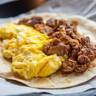 a burrito with eggs and sausage