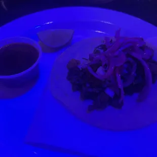 Carne asada taco, the blue light above me threw off the picture.