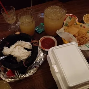 a table full of food and drinks