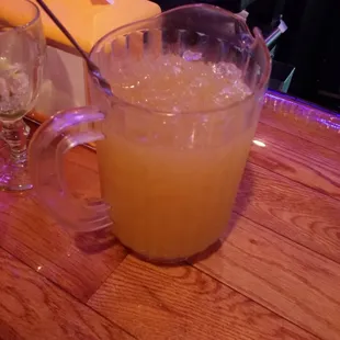 a pitcher of orange juice
