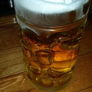 a glass of beer on a table
