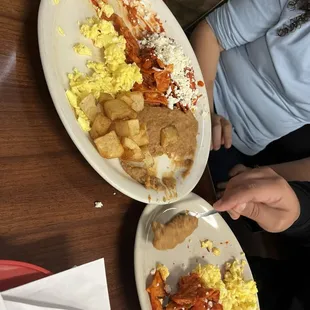 Chilaquiles plate. Too much onion for my daughter so I ate the plate. lol. Not bad, but I&apos;ve had better.