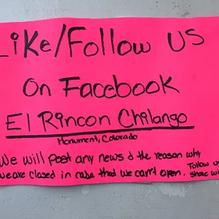 a sign posted on a wall