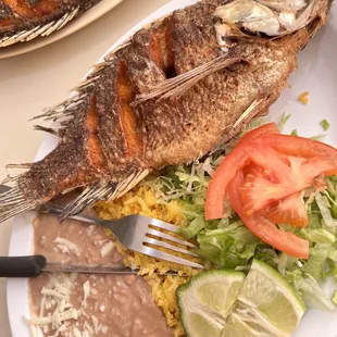 a plate of fish and beans