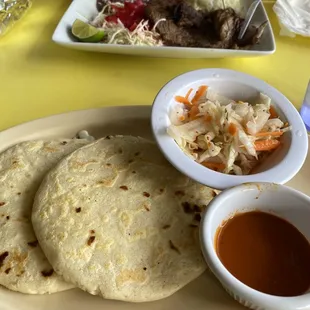 Delicious cheese baleada in front.  Carne asada in background