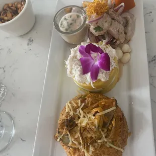 Trio de ceviche arroz con mariscos and Causa