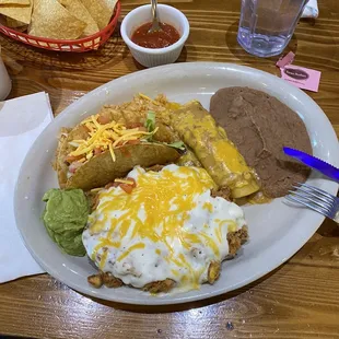 Chicken fried steak, chicken enchilada, crispy taco, refried beans, guacamole. Awesome