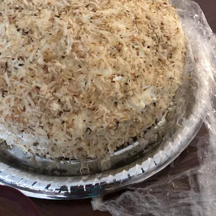 a cake covered in coconut flakes