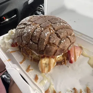 Concha rellena filled with strawberries banana Nutella lechera and whip cream!