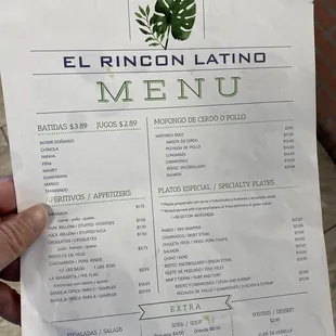 a person holding a menu