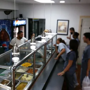 People line up to take out their lunch every day...