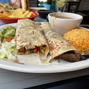 Tacos al Carbon, served like enchiladas with the tiniest serving of guac and pico.