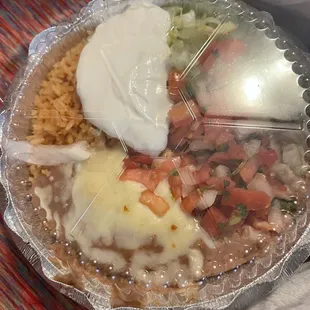 Specified to be plain rice, no beans no salad. This is what he received.....