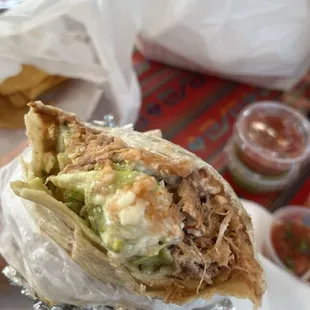Carnitas Burrito Supreme. HUGE burritos and super fresh and flavorful. Really great service and decent prices! I'll be back.