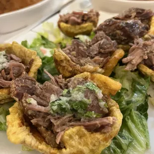 Relleno de tostones con pernil.. to die for... relleno de papas, in the back ground.. Lord help me...