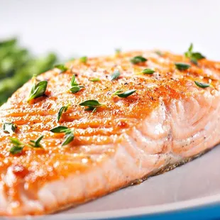 a plate of salmon and asparagus