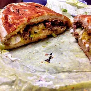 Carne Asada Torta, stuffed with meat and the bun is light, buttery and grilled.