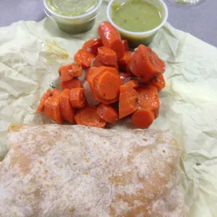 Chicken burrito, lots of carrots, and double green sauce please