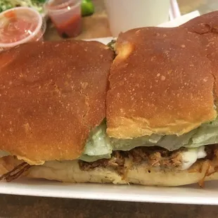 a sandwich with meat and lettuce