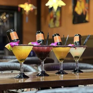 a row of cocktails