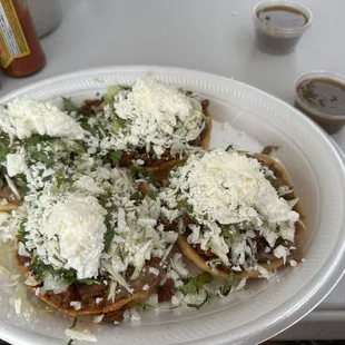 Sopes with pastor and everything on it