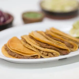 The house special: Tacos al vapor. Steamed flavorful tacos, with your choice of potato, shredded beef, beans, and chicharron filling.