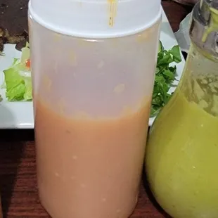 two condiments and a salad