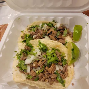 Asada tacos with cilantro and onion with handmade tortillas