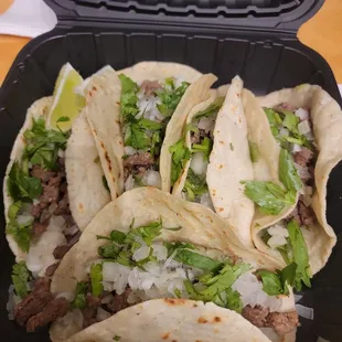 Carne asada tacos with cilantro and onion