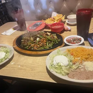 Mixed fajitas for 2 chicken &amp; steak, rice, beans, lettuce &amp; sour cream. Chips &amp; salsa
