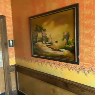 a painting on the wall of a hallway