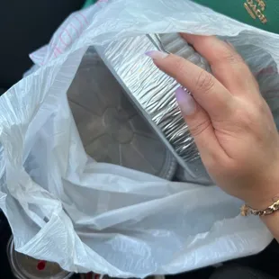 a woman's hand holding a purse