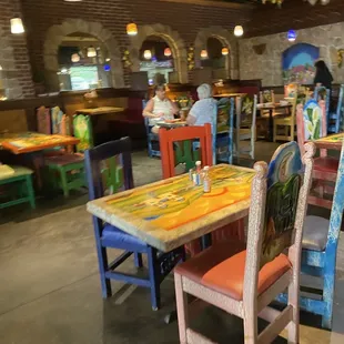 colorful tables and chairs in a restaurant