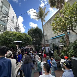 a crowd of people walking down a street