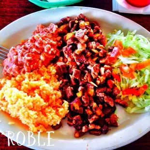 Steak ala Mexicana with beans and rice.