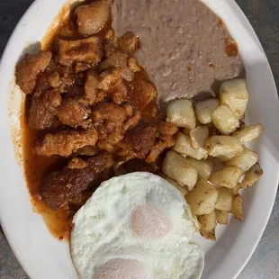 chicharon breakfast plate with eggs over medium