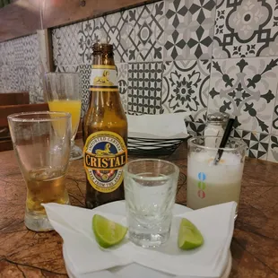Pisco shot , beer Cristal ,pisco cocktail drink and maracuja juice