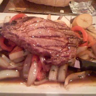 Carne a la Parrilla Encebollada