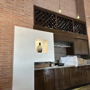 a brick wall with a wine rack