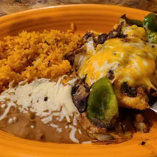 Pollo Monterrey served with rice and beans