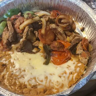Lunch Steak Fajitas with beans and tortillas