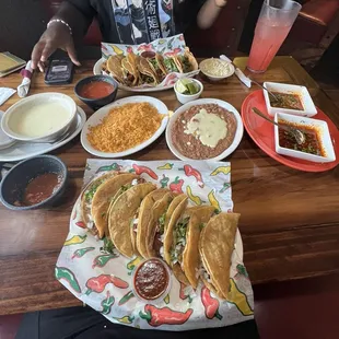 Consome and Birria tacos (12) rice &amp; beans with cheese and queso