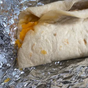 a burrito wrapped in tin foil