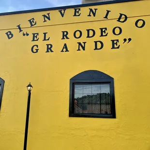 a yellow building with black lettering