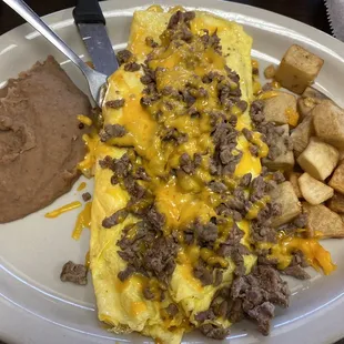 Steak omelette, three salsa choices and homemade corn tortillas.  Endless coffee can even get some to go.