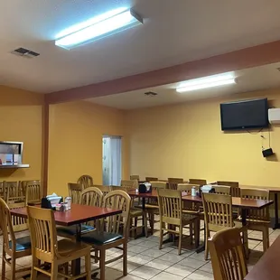 a restaurant with tables and chairs
