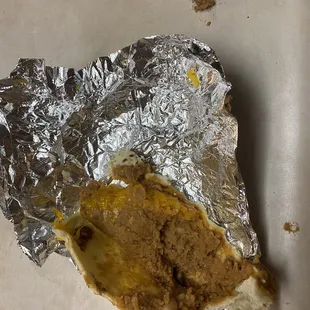 Bean and cheese taco with debris