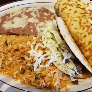 $8.99  Combination 6 - BEEF TACO, ONE GRILLED CHICKEN QUESADILLA, RICE AND BEANS