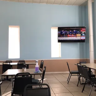 empty tables and chairs in a restaurant