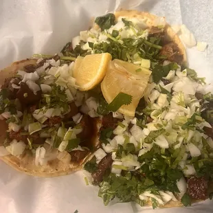 Taco de tripa that has been fried way too many times and lengua tacos.. lengua that has been marinating in the skillet for days